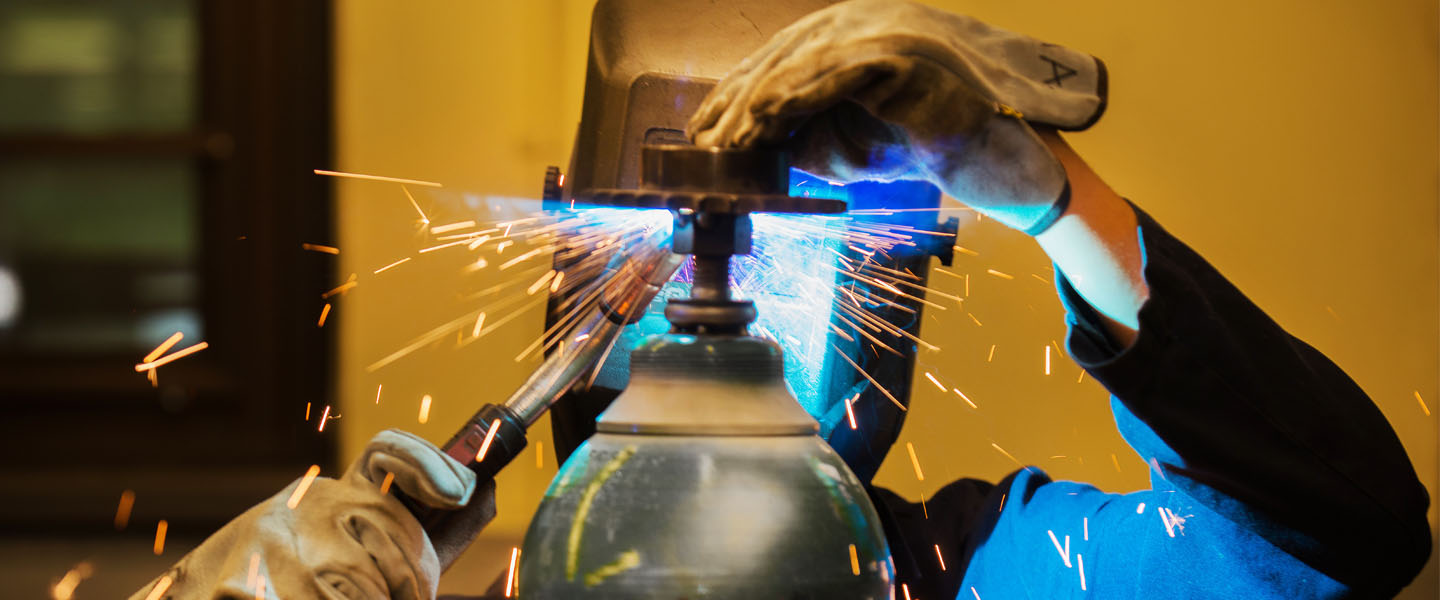 Mechanical engineering student welding 