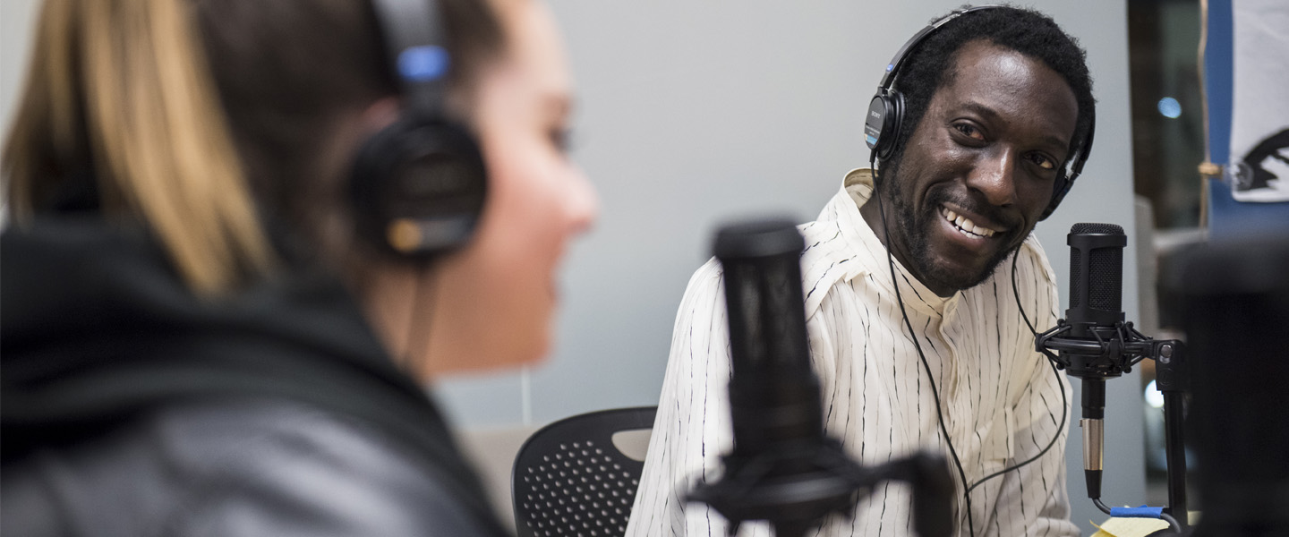 Students talk on a podcast show