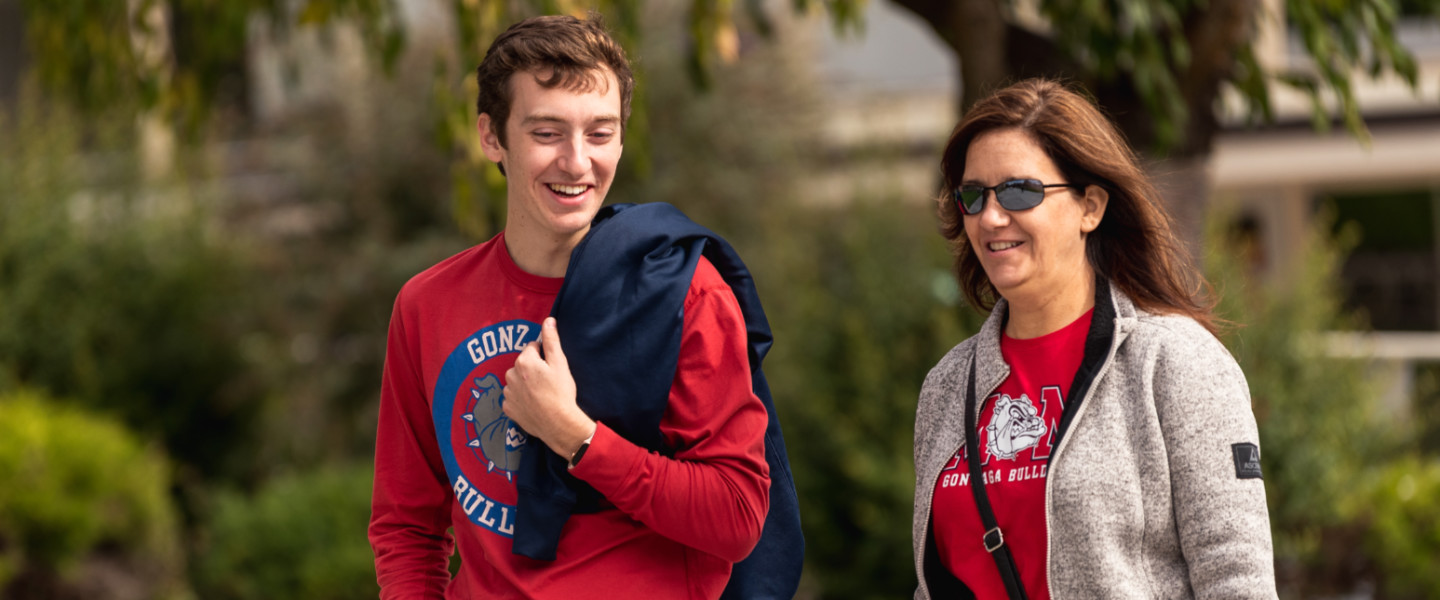 Mother and son walking on campus